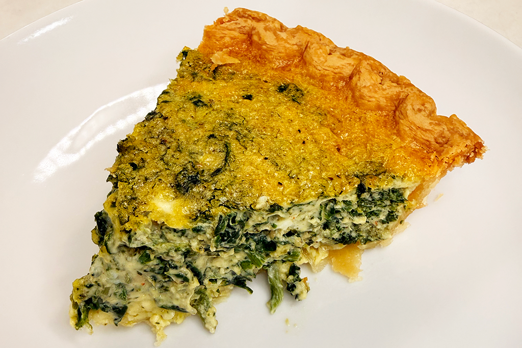 a slice of basil pesto quiche 