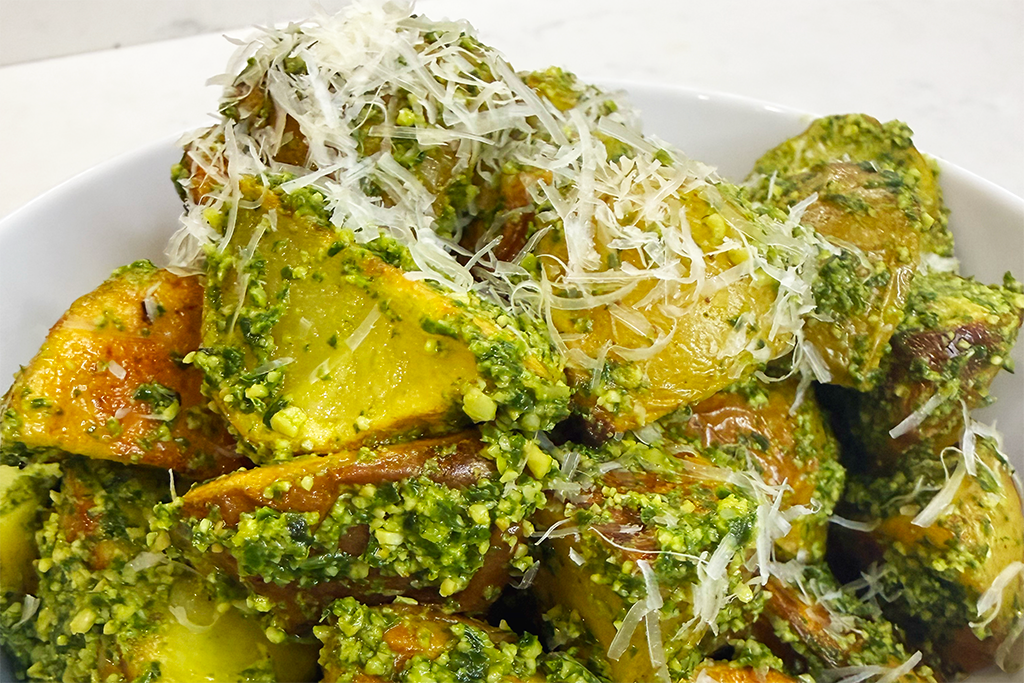 basil covered roasted potatoes with parmesan cheese