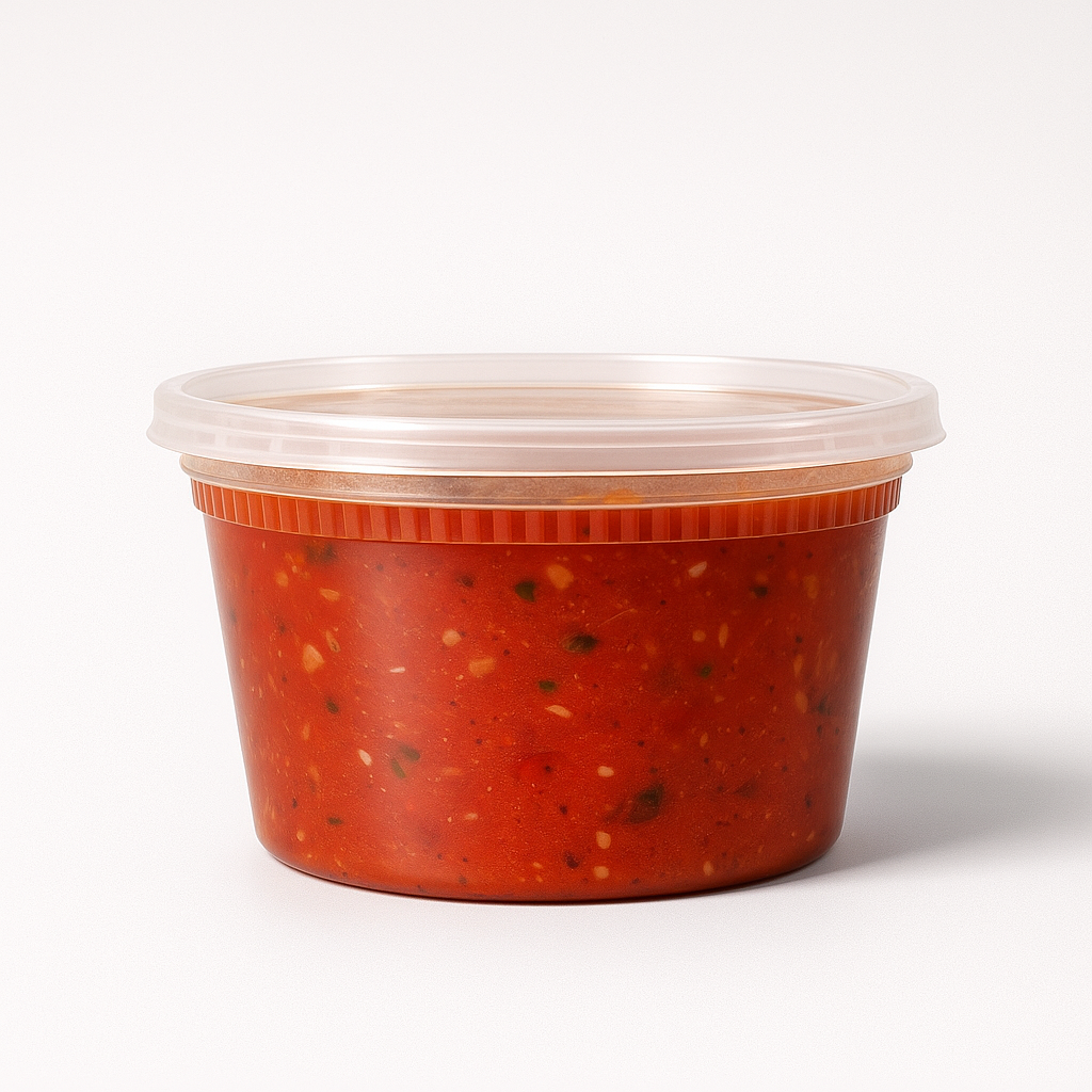 Red container with marinara sauce in a clear lid on a white background